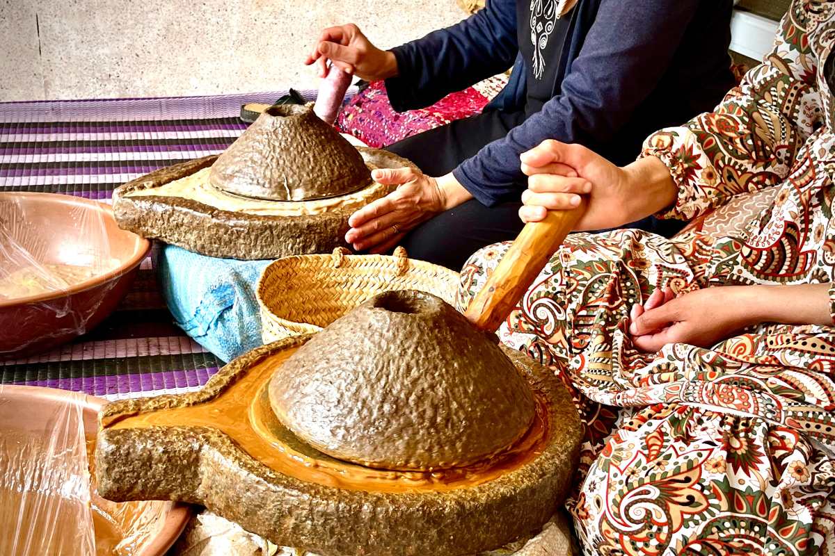 Pure Moroccan Argan Oil being filtered naturally by Amazigh women in a traditional cooperative